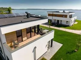 Hangar 19 Luxusapartment mit Sauna, Kamin, Dachterrasse und Seeblick H5W3