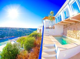 Seafront Villa Bellavista with heated pool, family hotel in Cala'n Porter