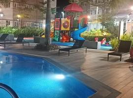 Happy Stays B - End Unit Greenery View at SMDC Hope Residences, hotel med pool i Trece Martires