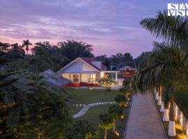 StayVista's Rupohi - Jorhat with Manicured Lawn & Gazebo, cottage in Jorhāt