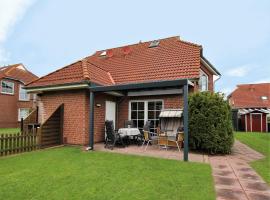 Ferienhaus in Neßmersiel am Nordseestrand, hotel in Neßmersiel