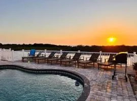 Gorgeous vacation home on the water with heated pool and sand!