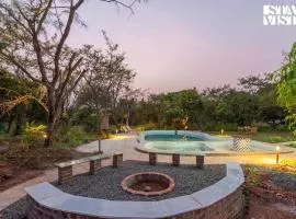 StayVista's Maativan - Mud House Amidst Orchards, Holistic Retreat with Outdoor Pool & Fireplace