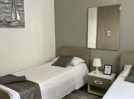 F10-2 Room 2 single beds shared bathroom in shared Flat