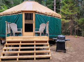 Allie Mae Yurt nestled in the woods, luxe tent in Brownfield