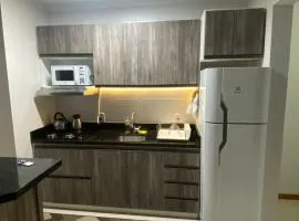 Apartamento NOVO completo com garagem e suíte no centro