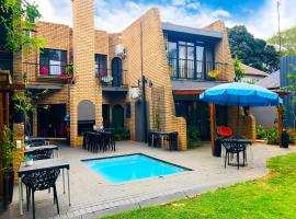 Grafiti Boutique Hotel, hotel met hottubs in Bela-Bela