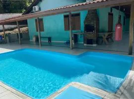 Casa com piscina na praia de Boiçucanga