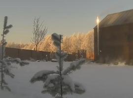 Domek Mazurski całoroczny nad jeziorem z Jacuzzi SPA, hotel em Pasym