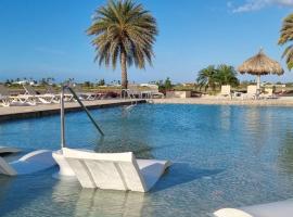 3 minutes from best beaches in Aruba! Luxury Tropical Townhouse at Gold Coast Aruba, hotel in Eagle Beach