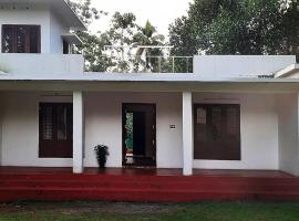 Louis Garden Homestay, hospedagem domiciliar em Mararikulam