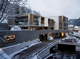 DOLOMITI EXCLUSIVE YOUR MOUNTAIN SUITE, hotel con spa en Pozza di Fassa