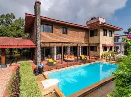 StayVista's Woodstone Villa - Mountain Retreat with Heated Pool & Activities