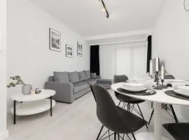 Apartment with Balcony by the Park in Łódź by Renters Prestige