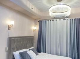 Grace Residences Elevate Escapes - near BGC airport, hôtel à Manille