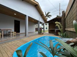 Casa privativa a 2 quadras da Praia da Ferrugem, hotel Garopabában