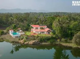 StayVista's Waterway Retreat - Lakeside Oasis with Infinity Pool