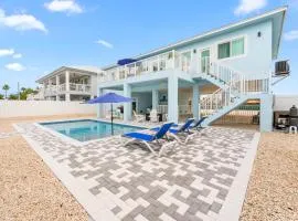 Blue Pearl New Waterfront Haven with Heated Pool ,70 Foot Dock, and More!