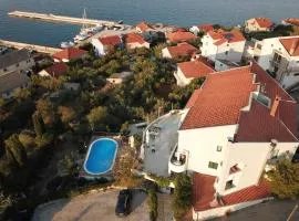 Seaside apartments with a swimming pool Kali, Ugljan - 14116