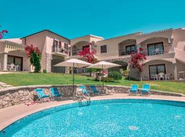 Residence con piscina a Badesi, appartamenti con WIFI e A.C، فندق في باديسي