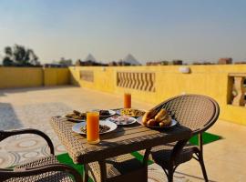 Nefertiti guest house view pyramids, hotel in Cairo