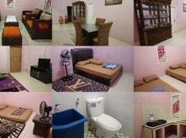 AL IZZAM HOMESTAY, hotel with parking in Pagaralam