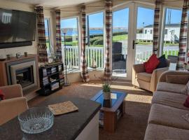 Lovely and Bright Caravan Haven Littlesea with views across the Fleet Lagoon, village vacances à Weymouth