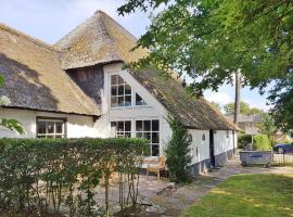 Luxuriously restored farmhouse with trendy interior close to sea and forest, hotel in Groet