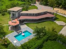 Bel Air Mansion by StayVista - A tranquil oasis with a spacious deck, Gazebo, Sauna, Jacuzzi & A mini-amphitheatre