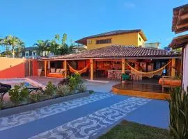 Casa Mukau pé na areia