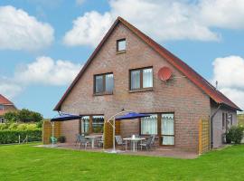 Spacious apartments with private terrace near the North Sea dike Nessmersiel, hotel a Nessmersiel