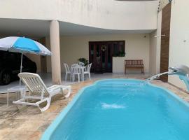 Casa 3 suítes com piscina โรงแรมในนาตาล