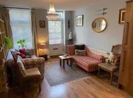 Quirky town centre apartment with river terrace