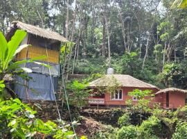 Mamalakandam Tree House, hotel con estacionamiento en Mamalakandam