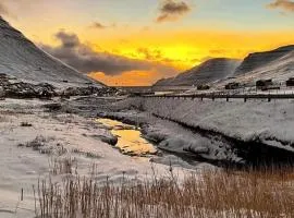 Experience unique Faroe Islands holiday home by the sea with great views, fully equipped kitchen and reliable Wi-Fi