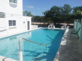 See Belize WATERSIDE Sea View Suite with Infinity Pool & Overwater Deck, apartment in Belize City
