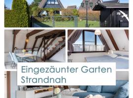 Ferienhaus Küstenkind - Top Lage - Garten eingezäunt, Hotel in Butjadingen