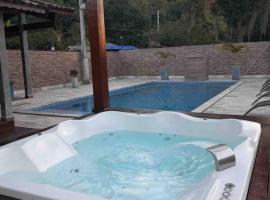 @ Chácara 5 Anjos - Jacuzzi Incrível Água Quente, hotel z jacuzziji v mestu Itanhaém