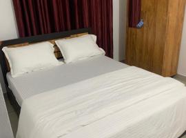 Wayanad Rooms Izza, hotel din Sultan Bathery