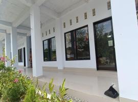 OYO 93638 Lotus Guest House, hotel in Lombok