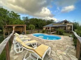 Maison de 3 chambres a Deshaies a 850 m de la plage avec vue sur la mer piscine partagee et jardin clos