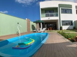 Casa Recanto dos Corais em Praia Grande, hotel dengan kolam renang di Santa Cruz