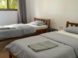 The Ranch - beautiful twin room, hospedagem domiciliar em Lusaka