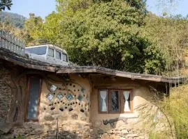 Hidden Earthen Home With An SUV Car As Entrance