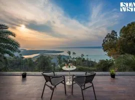 StayVista's Lake Pearl Serenity - Riverside, Mountain-View Villa with Jacuzzi, Sprawling Lawn & Terrace