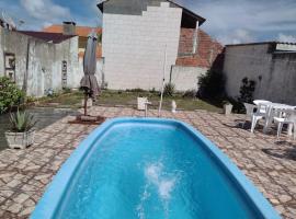 CASA COM PISCINA EM BALNEÁRIO PINHAL RS, hotel in Pinhal