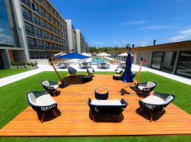 Resort com Piscina Aquecida e Garagem em Xangri-lá, hotel din Xangri-lá