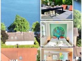 Snug Stays I 3 Zimmer Design Apartment am See mit Garten I Home Office I Highspeed Wifi, hotel in Weßling