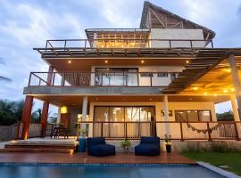 Casa confortável com vista mar e piscina – hotel z parkingiem w mieście Barrinha