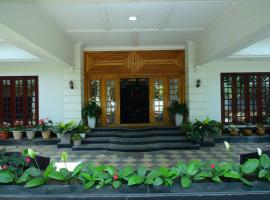 Serenity Cottage Luxury Homestay Virajpet, hospedagem domiciliar em Virajpet